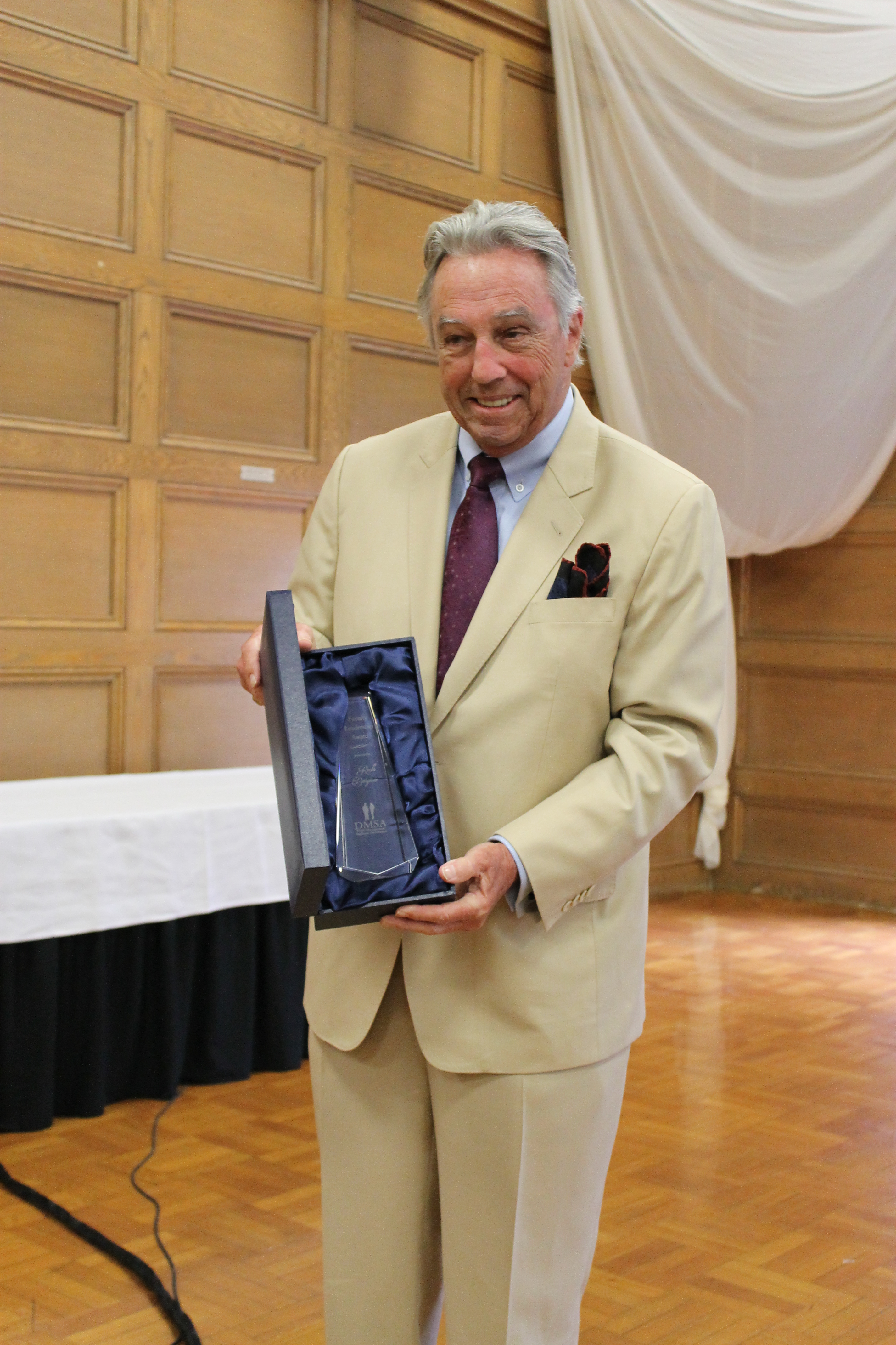 Prof Burjaw with the DMSA Award